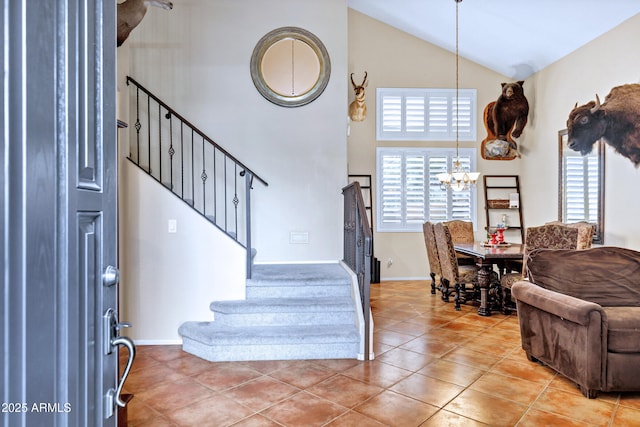 2758 N Sterling, Mesa, AZ 85207 - foyer entrance featuring high vaulted ceiling, stairs, light tile patterned flooring, a chandelier, and baseboards