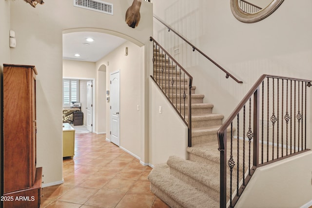 2758 N Sterling, Mesa, AZ 85207 - staircase with arched walkways, tile patterned flooring, baseboards, and recessed lighting