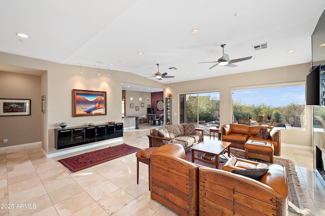 tiled living room featuring lofted ceiling