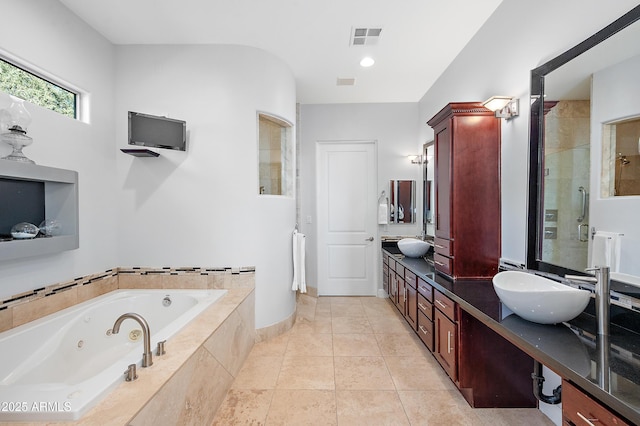 bathroom featuring vanity, tile patterned flooring, and independent shower and bath