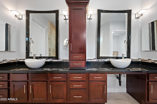 bathroom with tile patterned floors and vanity