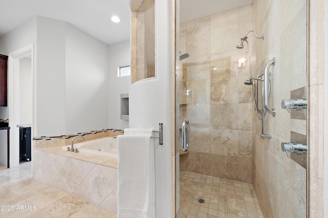 bathroom featuring shower with separate bathtub