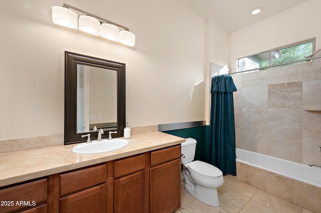 full bathroom featuring tile patterned floors, vanity, toilet, and shower / bath combo