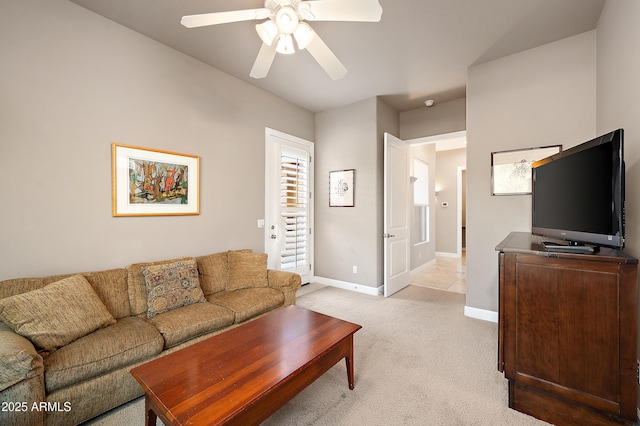 living room featuring light colored carpet and ceiling fan