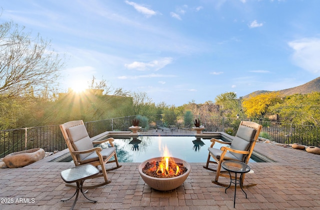 view of patio / terrace with a fire pit