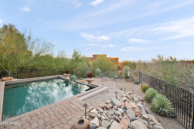 view of pool featuring a patio area