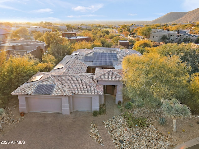 birds eye view of property with a mountain view