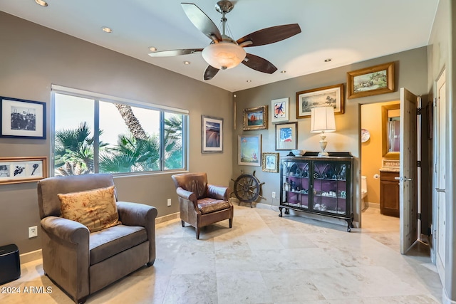 sitting room featuring ceiling fan