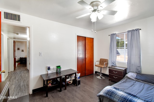 706 E Roosevelt Ave, Buckeye, AZ 85326 - bedroom featuring dark wood-type flooring, a closet, ceiling fan, and baseboards