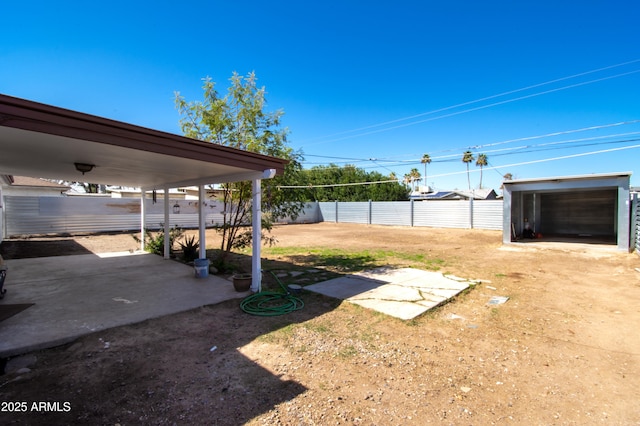 706 E Roosevelt Ave, Buckeye, AZ 85326 - fenced backyard featuring a patio