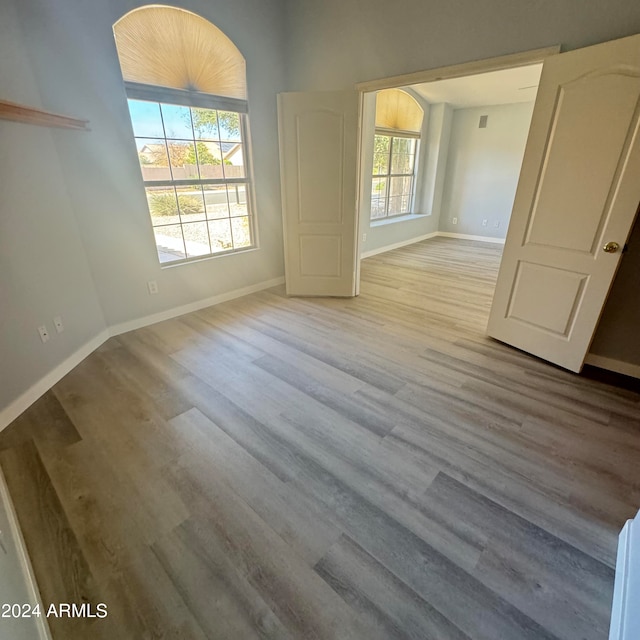 spare room featuring light hardwood / wood-style floors