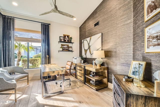 office area with high vaulted ceiling, light hardwood / wood-style floors, and ceiling fan