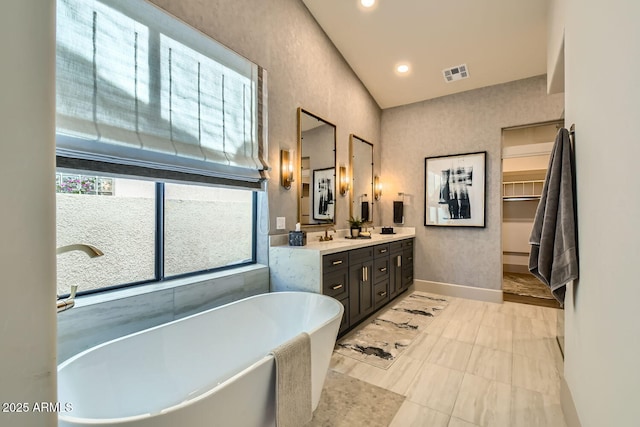 bathroom featuring vanity and a bathtub