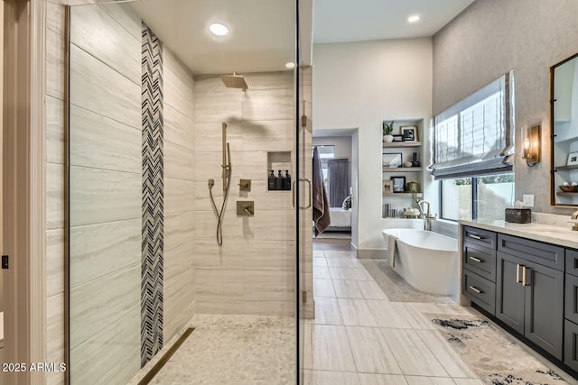 bathroom featuring vanity and plus walk in shower