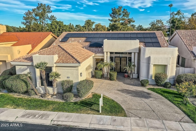 view of front of house with solar panels