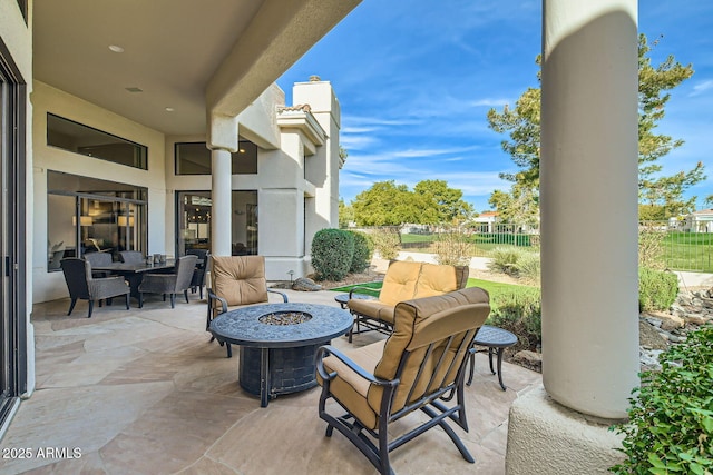 view of patio / terrace featuring an outdoor fire pit