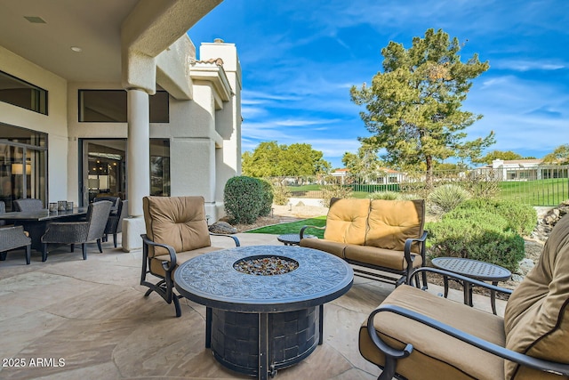 view of patio / terrace featuring an outdoor living space with a fire pit