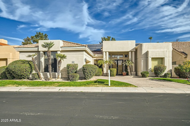 view of front of home with solar panels