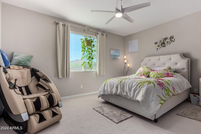 carpeted bedroom featuring baseboards and ceiling fan