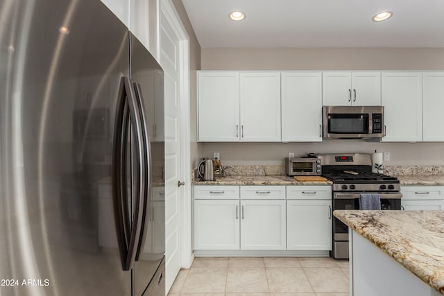 kitchen with recessed lighting, appliances with stainless steel finishes, and white cabinetry