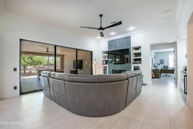 16772 W Cypress St, Goodyear, AZ 85395 - living area with a ceiling fan, plenty of natural light, a tile fireplace, crown molding, and recessed lighting