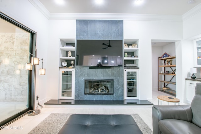 16772 W Cypress St, Goodyear, AZ 85395 - living room with built in shelves, ornamental molding, a fireplace, and baseboards
