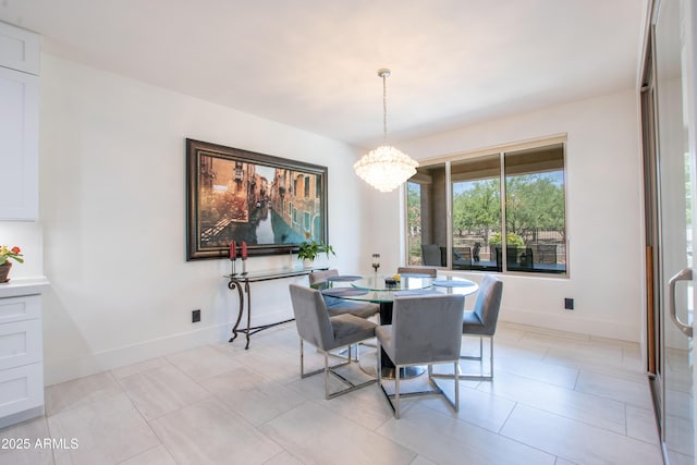16772 W Cypress St, Goodyear, AZ 85395 - dining area with a chandelier and baseboards
