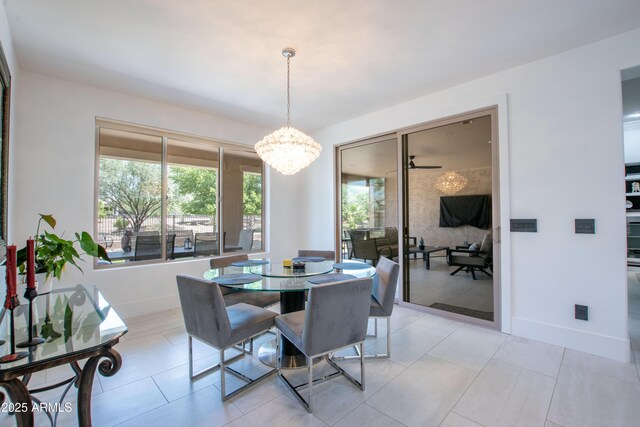 16772 W Cypress St, Goodyear, AZ 85395 - dining space with a chandelier, baseboards, and light tile patterned flooring
