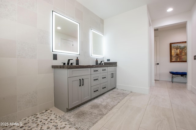 16772 W Cypress St, Goodyear, AZ 85395 - bathroom with double vanity, recessed lighting, and baseboards