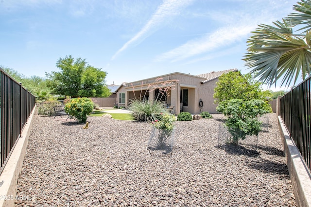 16772 W Cypress St, Goodyear, AZ 85395 - back of property with a fenced backyard, stucco siding, and a patio area