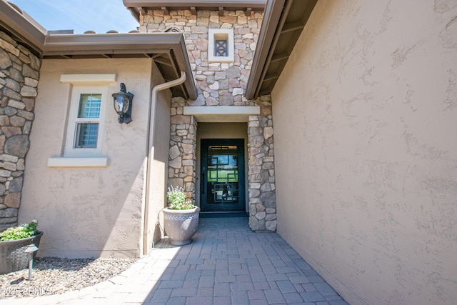 16772 W Cypress St, Goodyear, AZ 85395 - view of exterior entry featuring stone siding and stucco siding