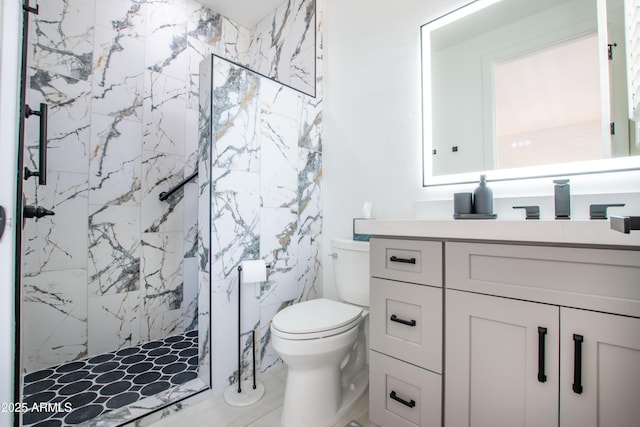 16772 W Cypress St, Goodyear, AZ 85395 - bathroom featuring vanity, toilet, and a marble finish shower