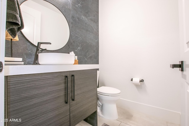 16772 W Cypress St, Goodyear, AZ 85395 - bathroom featuring toilet, vanity, baseboards, and tile patterned floors