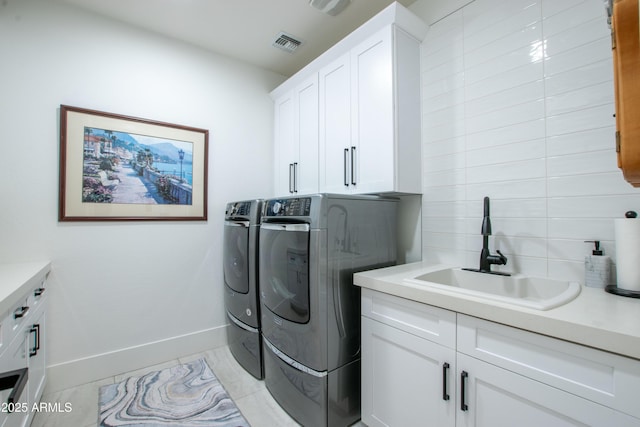 16772 W Cypress St, Goodyear, AZ 85395 - laundry area with cabinet space, independent washer and dryer, and baseboards