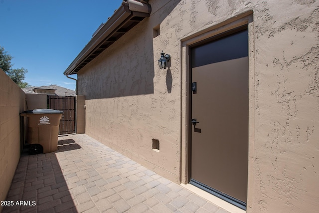16772 W Cypress St, Goodyear, AZ 85395 - entrance to property featuring stucco siding and a gate