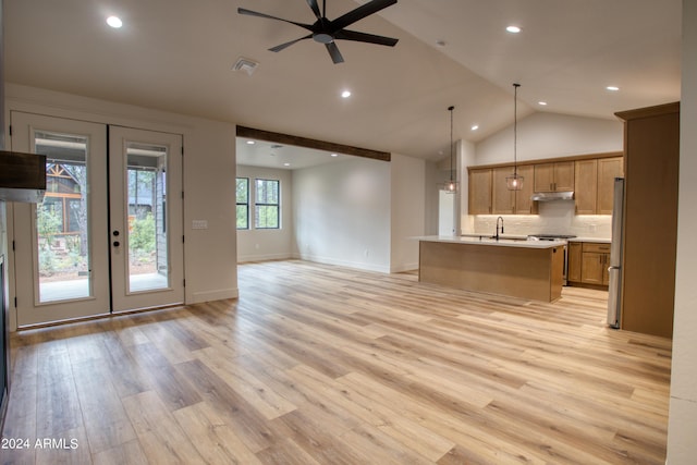 unfurnished living room with french doors, visible vents, a sink, ceiling fan, and light wood-type flooring