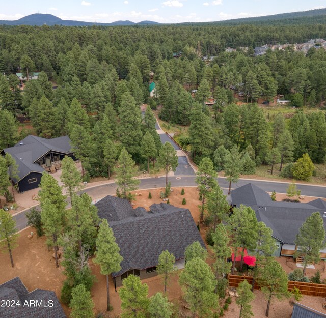 aerial view with a forest view and a mountain view