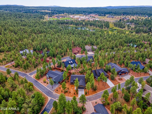 bird's eye view with a residential view and a wooded view