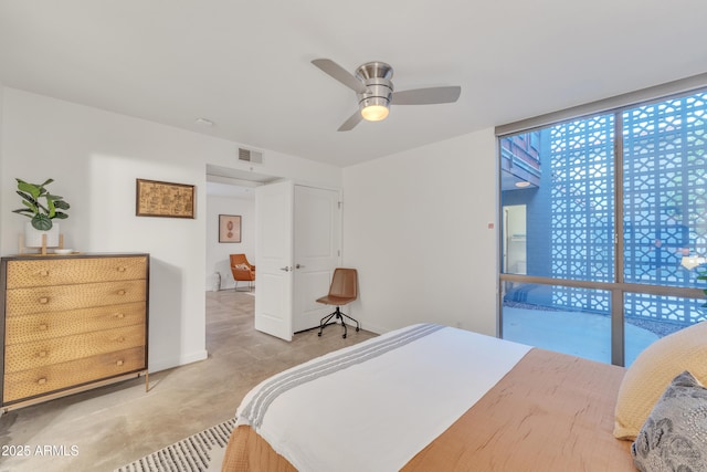 bedroom with baseboards, ceiling fan, concrete flooring, and visible vents