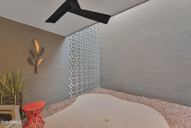 bathroom featuring brick wall