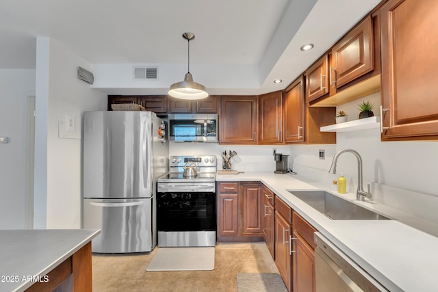 kitchen featuring visible vents, open shelves, light countertops, a sink, and stainless steel appliances