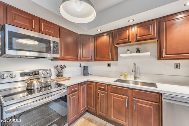 kitchen featuring open shelves, a sink, light countertops, stainless steel appliances, and recessed lighting