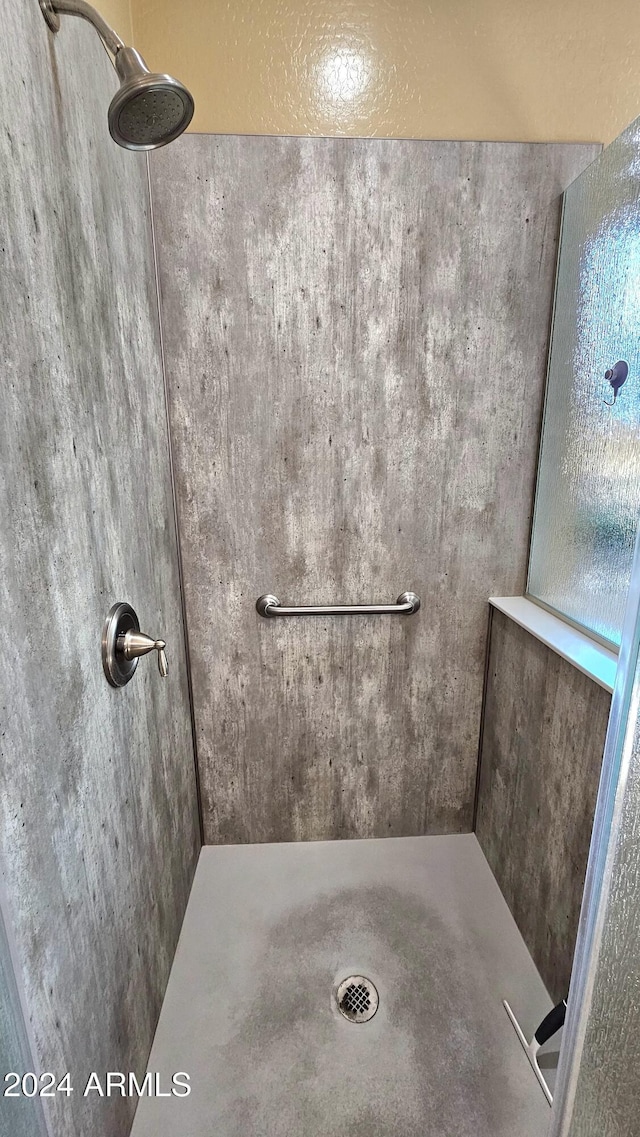 bathroom with tiled shower