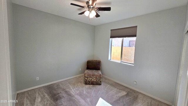 unfurnished room with ceiling fan and light colored carpet