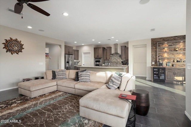 living room featuring ceiling fan and beverage cooler