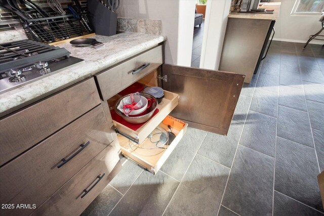 interior details with stainless steel gas stovetop