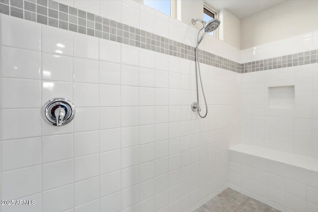 bathroom with tiled shower