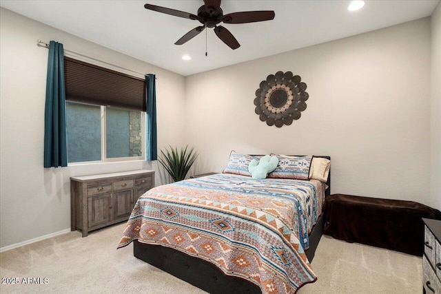 bedroom featuring light carpet and ceiling fan