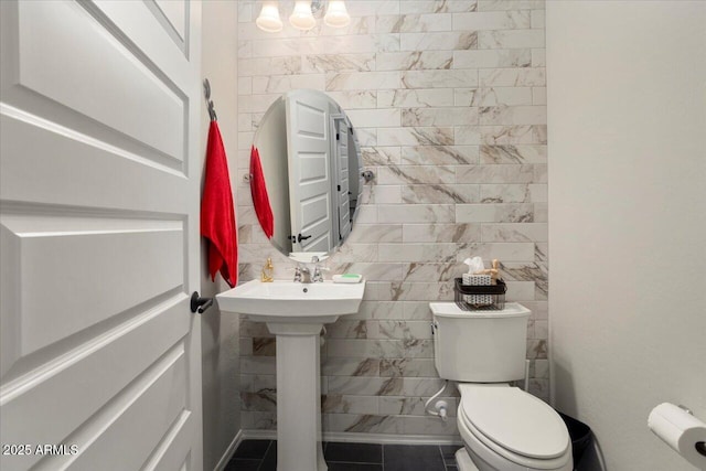 bathroom with tile patterned flooring and toilet