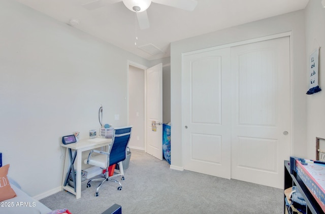 office area featuring a ceiling fan, carpet flooring, and baseboards